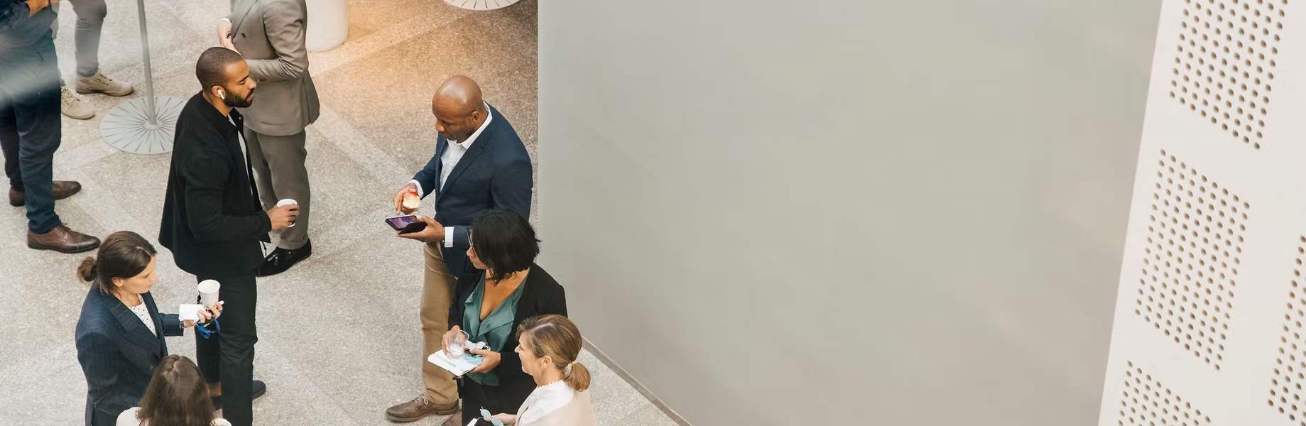 Insurance professionals in a modern office lobby